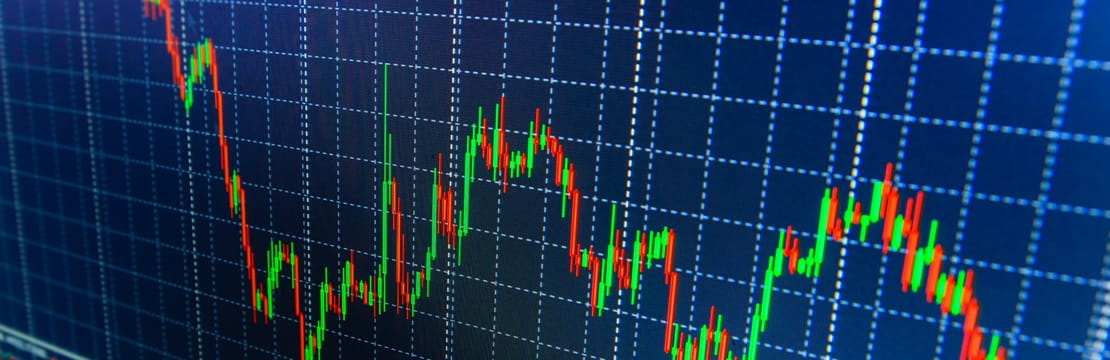 Stock market data projected onto a blue-colored screen